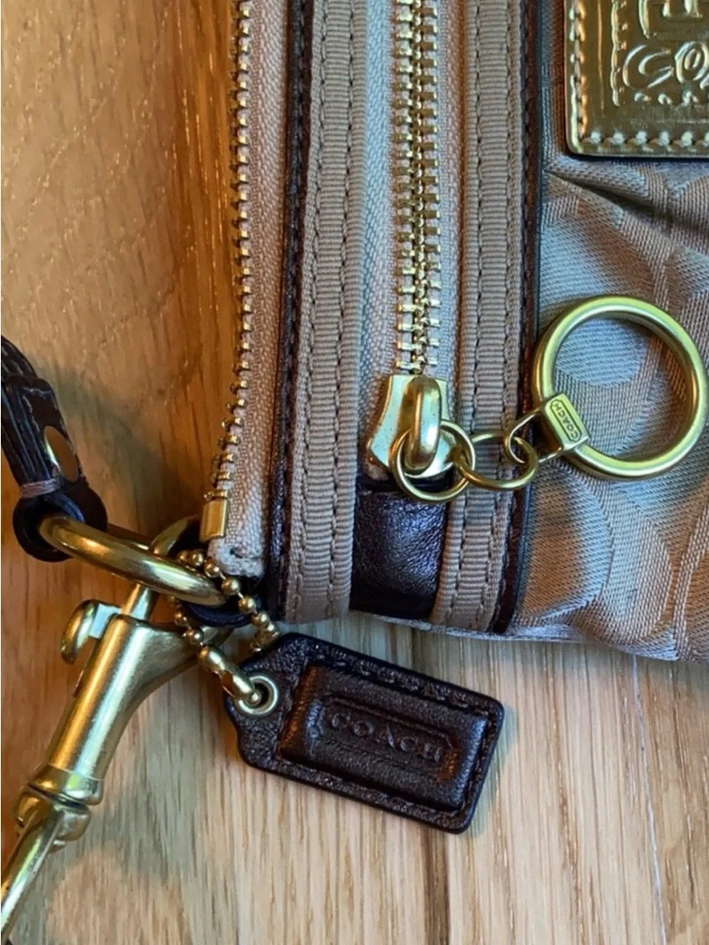 Coach Beige Signature Wristlet Pouch with Gold Logo Plaque